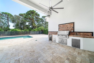 Discover luxury living at 326 Charroux Drive in prestigious on Frenchmans Reserve in Florida - for sale on GolfHomes.com, golf home, golf lot