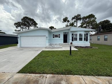 This beautifully updated stucco home is located only steps to on Del Tura Golf and Country Club in Florida - for sale on GolfHomes.com, golf home, golf lot