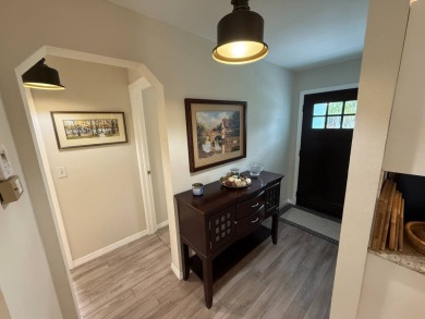 This beautifully updated stucco home is located only steps to on Del Tura Golf and Country Club in Florida - for sale on GolfHomes.com, golf home, golf lot