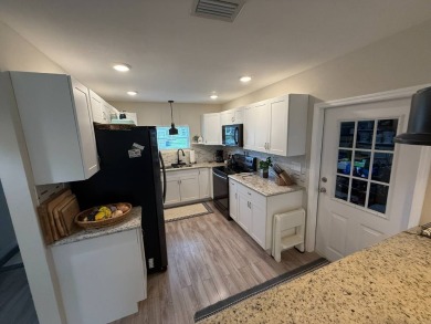 This beautifully updated stucco home is located only steps to on Del Tura Golf and Country Club in Florida - for sale on GolfHomes.com, golf home, golf lot