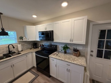 This beautifully updated stucco home is located only steps to on Del Tura Golf and Country Club in Florida - for sale on GolfHomes.com, golf home, golf lot