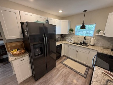 This beautifully updated stucco home is located only steps to on Del Tura Golf and Country Club in Florida - for sale on GolfHomes.com, golf home, golf lot