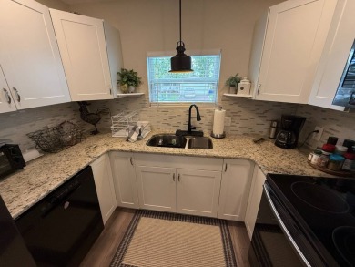 This beautifully updated stucco home is located only steps to on Del Tura Golf and Country Club in Florida - for sale on GolfHomes.com, golf home, golf lot