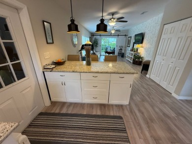 This beautifully updated stucco home is located only steps to on Del Tura Golf and Country Club in Florida - for sale on GolfHomes.com, golf home, golf lot