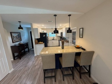 This beautifully updated stucco home is located only steps to on Del Tura Golf and Country Club in Florida - for sale on GolfHomes.com, golf home, golf lot