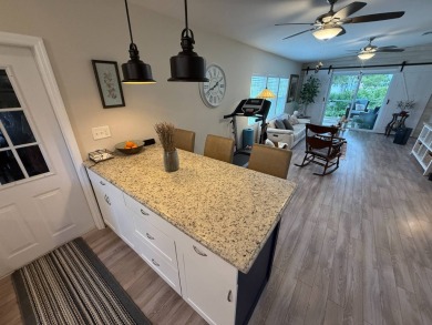 This beautifully updated stucco home is located only steps to on Del Tura Golf and Country Club in Florida - for sale on GolfHomes.com, golf home, golf lot