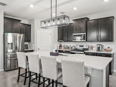 Experience luxury, flexibility, and privacy in this stunning and on Trilogy at Ocala Preserve in Florida - for sale on GolfHomes.com, golf home, golf lot