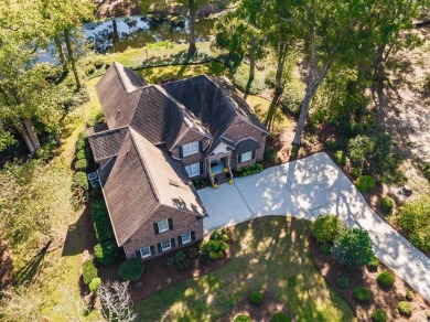 This is a beautiful brick home with loads of curb appeal in the on Litchfield Country Club in South Carolina - for sale on GolfHomes.com, golf home, golf lot