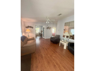 So much to love in this beautifully furnished 3-bed, 2-bath home on Sabal Springs Golf and Racquet Club in Florida - for sale on GolfHomes.com, golf home, golf lot