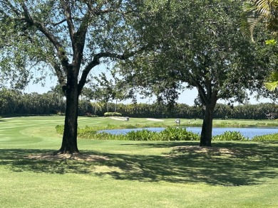 Golf course views fill this charming 2-story home of 4 bedrooms on Woodfield Country Club in Florida - for sale on GolfHomes.com, golf home, golf lot