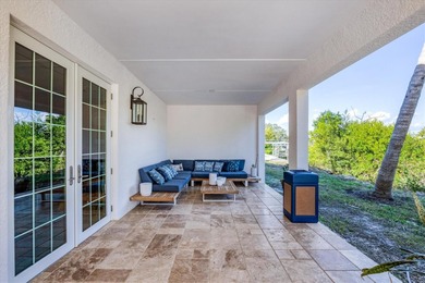 Experience unparalleled coastal living in this 2019 custom-built on Rotonda Golf and Country Club The Links Course in Florida - for sale on GolfHomes.com, golf home, golf lot