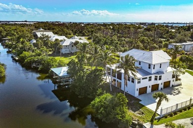 Experience unparalleled coastal living in this 2019 custom-built on Rotonda Golf and Country Club The Links Course in Florida - for sale on GolfHomes.com, golf home, golf lot