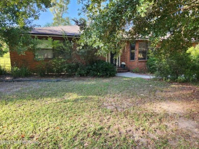 Sturdy brick ranch home with side entry garage.  Located on on Keystone Heights Golf and Country Club in Florida - for sale on GolfHomes.com, golf home, golf lot