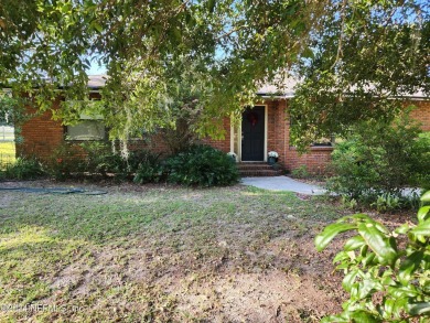 Sturdy brick ranch home with side entry garage.  Located on on Keystone Heights Golf and Country Club in Florida - for sale on GolfHomes.com, golf home, golf lot