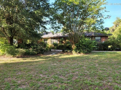 Sturdy brick ranch home with side entry garage.  Located on on Keystone Heights Golf and Country Club in Florida - for sale on GolfHomes.com, golf home, golf lot