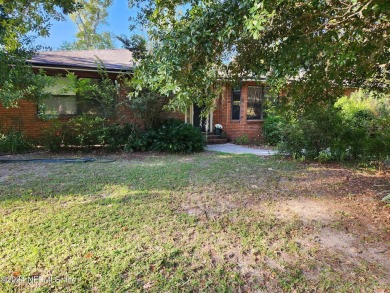 Sturdy brick ranch home with side entry garage.  Located on on Keystone Heights Golf and Country Club in Florida - for sale on GolfHomes.com, golf home, golf lot