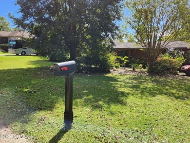 Sturdy brick ranch home with side entry garage.  Located on on Keystone Heights Golf and Country Club in Florida - for sale on GolfHomes.com, golf home, golf lot