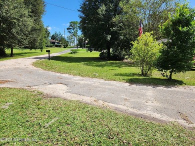 Sturdy brick ranch home with side entry garage.  Located on on Keystone Heights Golf and Country Club in Florida - for sale on GolfHomes.com, golf home, golf lot