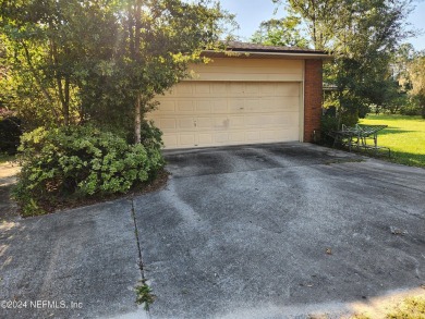 Sturdy brick ranch home with side entry garage.  Located on on Keystone Heights Golf and Country Club in Florida - for sale on GolfHomes.com, golf home, golf lot