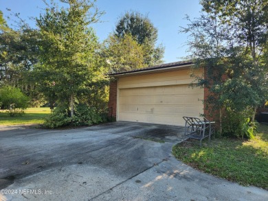 Sturdy brick ranch home with side entry garage.  Located on on Keystone Heights Golf and Country Club in Florida - for sale on GolfHomes.com, golf home, golf lot