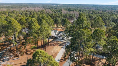 Discover this lovely 4 bedroom, 3.5 bathroom home located inside on Seven Lakes Country Club in North Carolina - for sale on GolfHomes.com, golf home, golf lot
