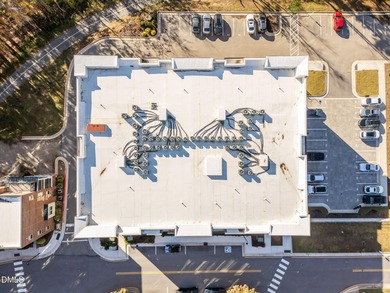 Lakeside living. First level condo conveniently situated on NCSU on Lonnie Poole Golf Course in North Carolina - for sale on GolfHomes.com, golf home, golf lot