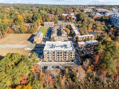 Lakeside living. First level condo conveniently situated on NCSU on Lonnie Poole Golf Course in North Carolina - for sale on GolfHomes.com, golf home, golf lot
