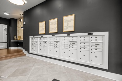 Lakeside living. First level condo conveniently situated on NCSU on Lonnie Poole Golf Course in North Carolina - for sale on GolfHomes.com, golf home, golf lot