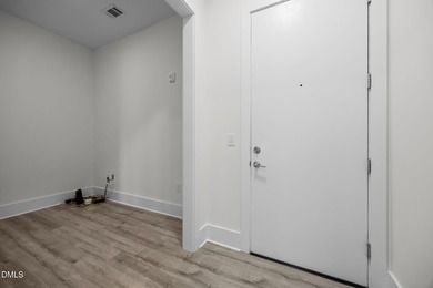 Lakeside living. First level condo conveniently situated on NCSU on Lonnie Poole Golf Course in North Carolina - for sale on GolfHomes.com, golf home, golf lot