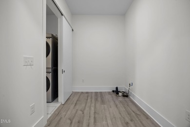 Lakeside living. First level condo conveniently situated on NCSU on Lonnie Poole Golf Course in North Carolina - for sale on GolfHomes.com, golf home, golf lot