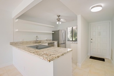 This stunning 2-bedroom, 2-bathroom condo is located on the on Fountains Golf and Country Club in Florida - for sale on GolfHomes.com, golf home, golf lot