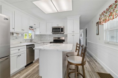 Step into the epitome of coastal charm and comfort with this on Twin Isles Country Club in Florida - for sale on GolfHomes.com, golf home, golf lot