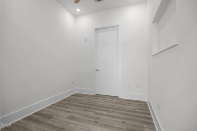 Lakeside living. First level condo conveniently situated on NCSU on Lonnie Poole Golf Course in North Carolina - for sale on GolfHomes.com, golf home, golf lot