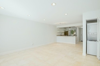 This stunning 2-bedroom, 2-bathroom condo is located on the on Fountains Golf and Country Club in Florida - for sale on GolfHomes.com, golf home, golf lot