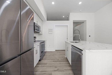 Lakeside living. First level condo conveniently situated on NCSU on Lonnie Poole Golf Course in North Carolina - for sale on GolfHomes.com, golf home, golf lot