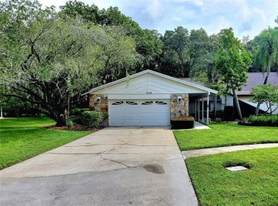 ** TOTAL REMODEL 2024!** Enjoy maintenance-free living with a on Tarpon Woods Golf Club in Florida - for sale on GolfHomes.com, golf home, golf lot