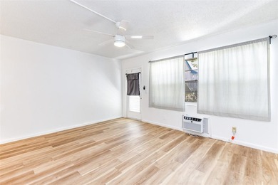 Beautifully remodeled first-floor unit filled with natural light on Hillsboro Pines Golf in Florida - for sale on GolfHomes.com, golf home, golf lot