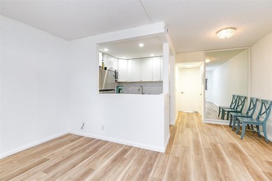 Beautifully remodeled first-floor unit filled with natural light on Hillsboro Pines Golf in Florida - for sale on GolfHomes.com, golf home, golf lot