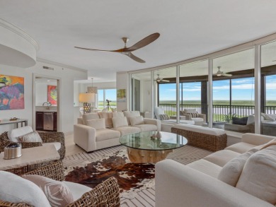 Experience refined coastal living in this elegant residence at on Hammock Bay in Florida - for sale on GolfHomes.com, golf home, golf lot