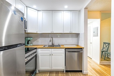 Beautifully remodeled first-floor unit filled with natural light on Hillsboro Pines Golf in Florida - for sale on GolfHomes.com, golf home, golf lot