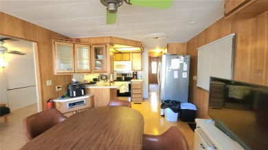 DOUBLE WIDE MOBILE HOME in active 55+ community. FIXER-UPPER IS on River Run Golf Links in Florida - for sale on GolfHomes.com, golf home, golf lot