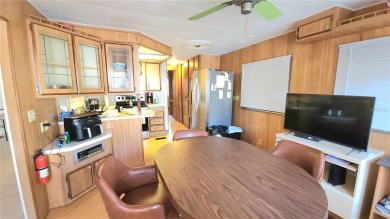 DOUBLE WIDE MOBILE HOME in active 55+ community. FIXER-UPPER IS on River Run Golf Links in Florida - for sale on GolfHomes.com, golf home, golf lot