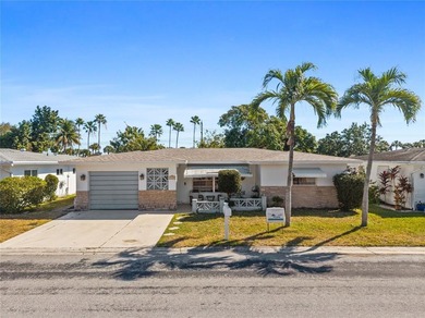 Welcome to this single-family home in Paradise Gardens IV in on Oriole Golf and Tennis Club in Florida - for sale on GolfHomes.com, golf home, golf lot