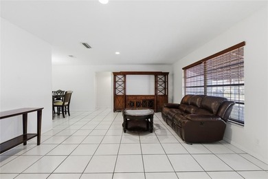 Welcome to this single-family home in Paradise Gardens IV in on Oriole Golf and Tennis Club in Florida - for sale on GolfHomes.com, golf home, golf lot