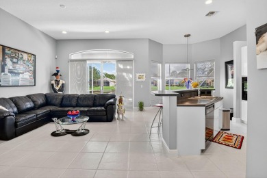 Experience lakefront living at it finest in this immaculate on Gleneagles Golf and Country Club in Florida - for sale on GolfHomes.com, golf home, golf lot