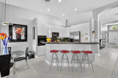 Experience lakefront living at it finest in this immaculate on Gleneagles Golf and Country Club in Florida - for sale on GolfHomes.com, golf home, golf lot