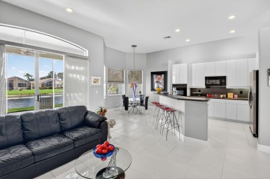 Experience lakefront living at it finest in this immaculate on Gleneagles Golf and Country Club in Florida - for sale on GolfHomes.com, golf home, golf lot