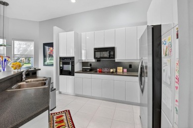 Experience lakefront living at it finest in this immaculate on Gleneagles Golf and Country Club in Florida - for sale on GolfHomes.com, golf home, golf lot
