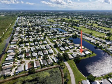Enjoy stunning lakefront views from this beautiful TRIPLE-wide on Savanna Golf Club in Florida - for sale on GolfHomes.com, golf home, golf lot