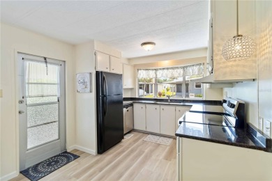 Welcome to a refined slice of paradise in the prestigious on Twin Isles Country Club in Florida - for sale on GolfHomes.com, golf home, golf lot